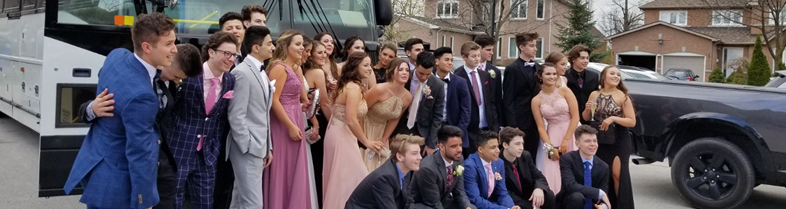 Posing a picture in front of party bus